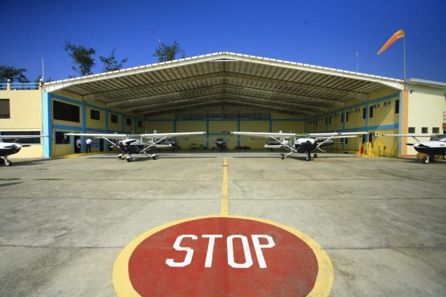 AAA aircraft hangar at Iba Airport with organized training aircraft