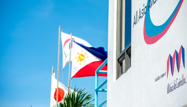 All Asia Aviation Academy international flight school campus in the Philippines with Japanese and Philippine flags