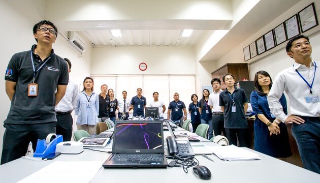 Japanese management team of All Asia Aviation Academy holding a morning meeting under Japanese-style operational standards