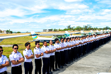 Students of All Asia Aviation Academy standing at the flight training base in Iba Airport, Philippines