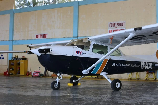 AAA Cessna 172P parked inside the aircraft hangar