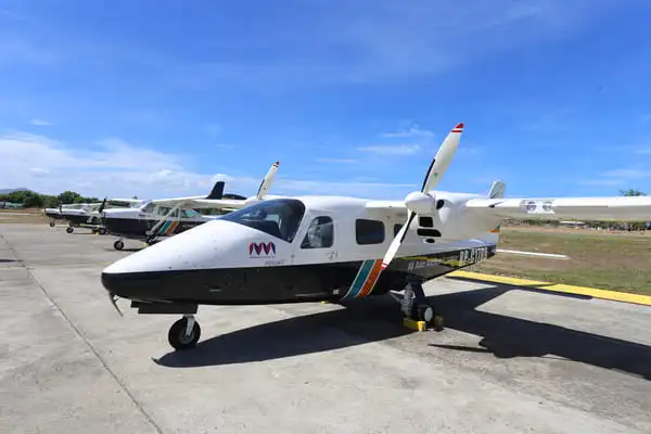 AAA TECNAM P2006T multi-engine training aircraft parked at the training area
